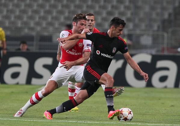 UEFA Champions League playoff first leg match match between Besiktas and Arsenal at Olympic stadium in istanbul 19 august 2014. Pictured: Mustafa Pektemek of Besiktas and Olivier Giroud of Arsenal. 