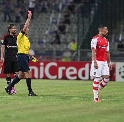 UEFA Champions League playoff first leg match match between Besiktas and Arsenal at Olympic stadium in istanbul 19 august 2014. Score: Besiktas 0 - Arsenal 0 Pictured: Referee Milorad Mazic and Aaron Remsey of Arsenal. 