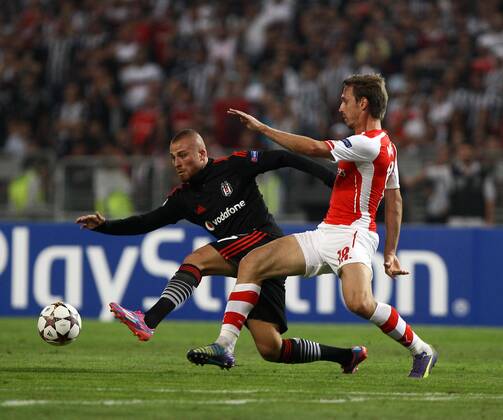 UEFA Champions League playoff first leg match match between Besiktas and Arsenal at Olympic stadium in istanbul 19 august 2014. Score: Besiktas 0 - Arsenal 0 Pictured: Gokhan Tore of Besiktas and Ignacio Nacho Monreal Eraso of Arsenal. 