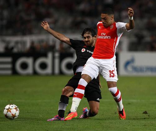 UEFA Champions League playoff first leg match match between Besiktas and Arsenal at Olympic stadium in istanbul 19 august 2014. Score: Besiktas 0 - Arsenal 0 Pictured: Alexander (Alex) Mark David Oxlade Chamberlain of Arsenal and Veli Kavlak of Besiktas. 