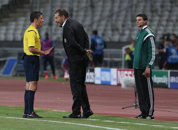 UEFA Champions League playoff first leg match match between Besiktas and Arsenal at Olympic stadium in istanbul 19 august 2014. Score: Besiktas 0 - Arsenal 0 Pictured: Referee Milorad Mazic and Coach Slaven Bilic of Besiktas. 