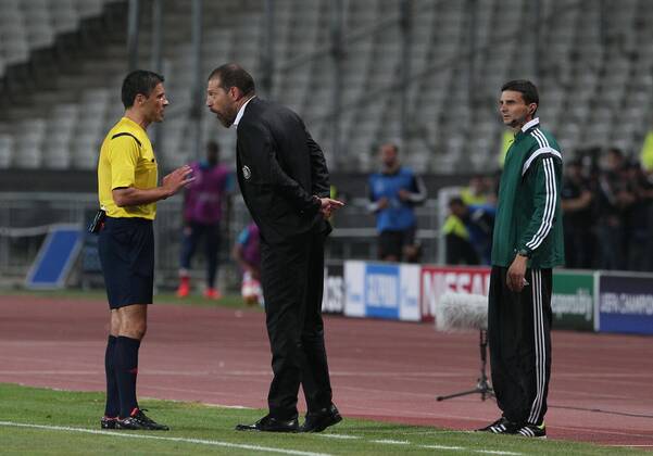UEFA Champions League playoff first leg match match between Besiktas and Arsenal at Olympic stadium in istanbul 19 august 2014. Score: Besiktas 0 - Arsenal 0 Pictured: Referee Milorad Mazic and Coach Slaven Bilic of Besiktas.