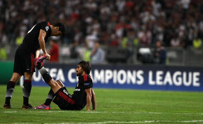UEFA Champions League playoff first leg match match between Besiktas and Arsenal at Olympic stadium in istanbul 19 august 2014. Score: Besiktas 0 - Arsenal 0 Pictured: Necip Uysal (L) and Veli Kavlak (R) of Besiktas.