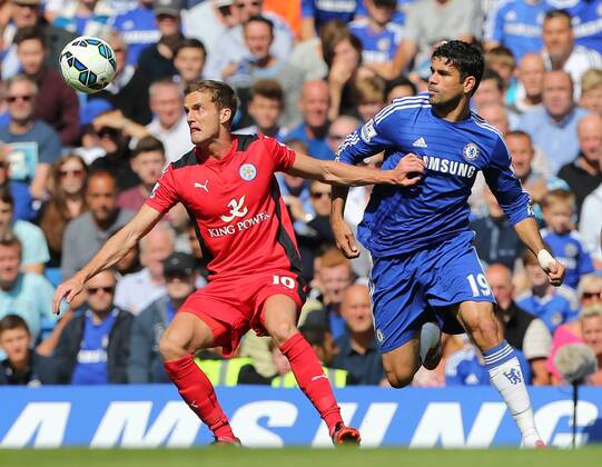 Chelsea s Diego Costa tussles with Leicester s Andy King - Barclays Premier League - FC Chelsea vs Leicester City - Stamford Bridge - London - England - 23rd August 2014 - Picture David Klein Sportimage EDITORIAL USE ONLY. No use with unauthorised audio, video, data, fixture lists, club league logos or live services. Online in-match use limited to 120 images, no video emulation. No use in betting, games or single club league player publications.