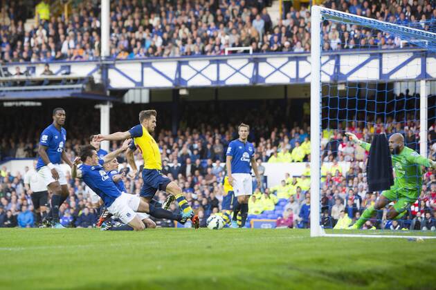 Arsenal s Aaron Ramsey scores his sides first goal (2-1) - FC Everton vs. FC Arsenal - Barclays Premier League - Goodison Park - Liverpool - 23 08 2014 EDITORIAL USE ONLY. No use with unauthorised audio, video, data, fixture lists, club league logos or live services. Online in-match use limited to 120 images, no video emulation. No use in betting, games or single club league player publications.