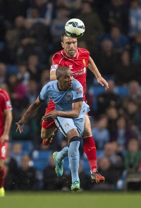 Rickie Lambert of Liverpool and Fernando of Manchester City in action - Manchester City vs. Liverpool - Barclays Premier League - Etihad Stadium - Manchester - 25 08 2014 Pic Philip Oldham Sportimage EDITORIAL USE ONLY. No use with unauthorised audio, video, data, fixture lists, club league logos or live services. Online in-match use limited to 120 images, no video emulation. No use in betting, games or single club league player publications.