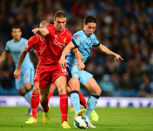 Jordan Henderson of Liverpool tussles with Samir Nasri of Manchester City - Barclays Premier League - Manchester City vs Liverpool - Etihad Stadium - Manchester - England - 25th August 2014 - Pic Simon Bellis Sportimage EDITORIAL USE ONLY. No use with unauthorised audio, video, data, fixture lists, club league logos or live services. Online in-match use limited to 120 images, no video emulation. No use in betting, games or single club league player publications.