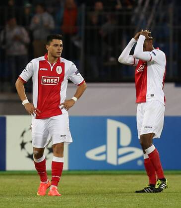 20140826 - SAINT PETERSBURG, RUSSIA: Standard s Jorge Teixeira and Standard s Ricardo Faty look dejected during the return leg match of the playoffs for the UEFA Champions League competition between Russian team FC Zenit Saint Petersburg and Belgian soccer team Standard de Liege in Saint Petersburg, Russia, Tuesday 26 August 2014. Zenit won the first leg 0-1. VIRGINIExLEFOUR  premiumd 18543