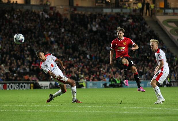 Manchester United s Nick Powell fires in a shot - Capital One Cup, Second Round - Milton Keynes Dons FC vs Manchester United (ManU) - Milton Keynes - England - 26th August 2014 - EDITORIAL USE ONLY. No use with unauthorised audio, video, data, fixture lists, club league logos or live services. Online in-match use limited to 120 images, no video emulation. No use in betting, games or single club league player publications.