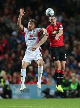 MK Dons Ben Reeves tussles with Manchester United s Michael Keane - Capital One Cup, Second Round - Milton Keynes Dons FC vs Manchester United (ManU) - Milton Keynes - England - 26th August 2014 - EDITORIAL USE ONLY. No use with unauthorised audio, video, data, fixture lists, club league logos or live services. Online in-match use limited to 120 images, no video emulation. No use in betting, games or single club league player publications.