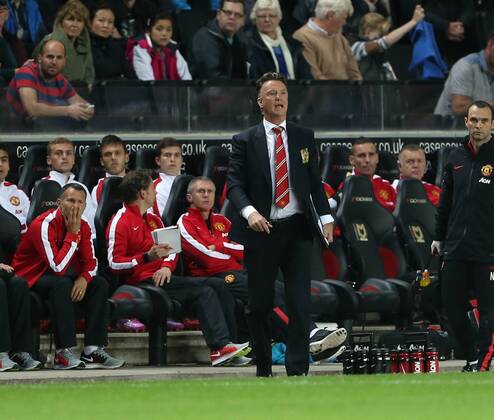 Manchester United s Louis Van Gaal looks on - Capital One Cup, Second Round - Milton Keynes Dons FC vs Manchester United (ManU) - Milton Keynes - England - 26th August 2014 - EDITORIAL USE ONLY. No use with unauthorised audio, video, data, fixture lists, club league logos or live services. Online in-match use limited to 120 images, no video emulation. No use in betting, games or single club league player publications.