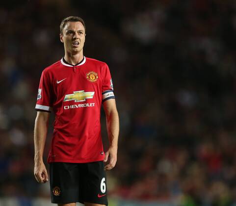Manchester United s Jonny Evans looks on dejected after gifting MK Dons their opening goal - Capital One Cup, Second Round - Milton Keynes Dons FC vs Manchester United (ManU) - Milton Keynes - England - 26th August 2014 - EDITORIAL USE ONLY. No use with unauthorised audio, video, data, fixture lists, club league logos or live services. Online in-match use limited to 120 images, no video emulation. No use in betting, games or single club league player publications.
