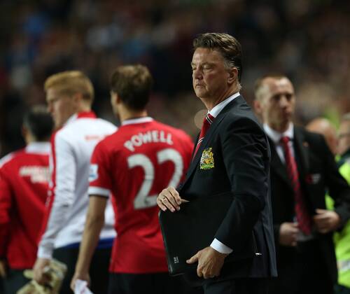 Manchester United s Louis Van Gaal looks on dejected at the final whistle - Capital One Cup, Second Round - MK Dons Stadium - Milton Keynes - England - 26th August 2014 - Picture David Klein Sportimage EDITORIAL USE ONLY. No use with unauthorised audio, video, data, fixture lists, club league logos or live services. Online in-match use limited to 120 images, no video emulation. No use in betting, games or single club league player publications.