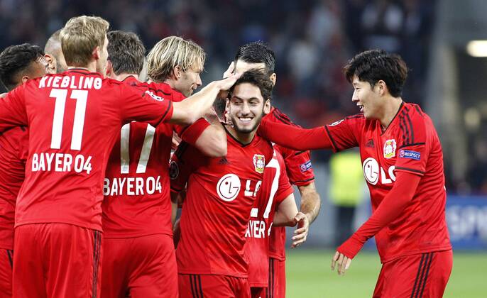 Leverkusens Hakan Calhanoglu celebrates scoring the 2:0 with Leverkusens Stefan Kießling (L) and Leverkusens Heung-Min Son during the Championsleague Play-off match between Bayer 04 Leverkusen and FC Kopenhagen, Bayarena in Leverkusen on August 27., 2013. Bayer 04 Leverkusen vs. FC Kopenhagen in der Champions League Qualifikation der Saison 2014 2015 am 27. August 2014.