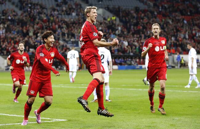 Leverkusens Stefan Kießling (M) celebrates scoring the 3:0 with Leverkusens Heung-Min Son (L) and Leverkusens Simon Rolfes during the Championsleague Play-off match between Bayer 04 Leverkusen and FC Kopenhagen, Bayarena in Leverkusen on August 27., 2013. Bayer 04 Leverkusen vs. FC Kopenhagen in der Champions League Qualifikation der Saison 2014 2015 am 27. August 2014.
