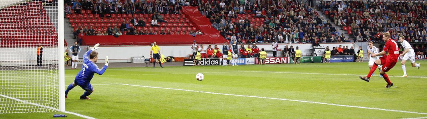 Leverkusens Stefan Kießling shots the 3:0 against Copenhagens goalkeeper Stephan Andersen during the Championsleague Play-off match between Bayer 04 Leverkusen and FC Kopenhagen, Bayarena in Leverkusen on August 27., 2013. Bayer 04 Leverkusen vs. FC Kopenhagen in der Champions League Qualifikation der Saison 2014 2015 am 27. August 2014.