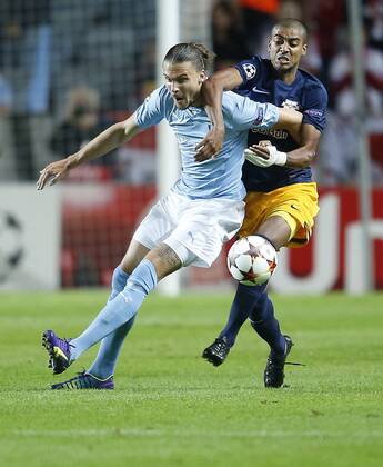 SOCCER - CL, Malmoe vs RBS MALMOE,SWEDEN,27.AUG.14 - SOCCER - UEFA Champions League, play off, Malmoe FF vs Red Bull Salzburg. Image shows Erik Johansson (Malmoe) and Alan de Carvalho (RBS). 