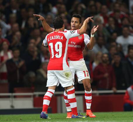 Arsenal s Alexis Sanchez celebrates scoring his sides opening goal - UEFA Champions League, Play-off Second Leg - Emirates Stadium - England - 27th August 2014 - Picture David Klein Sportimage EDITORIAL USE ONLY. No use with unauthorised audio, video, data, fixture lists, club league logos or live services. Online in-match use limited to 120 images, no video emulation. No use in betting, games or single club league player publications.