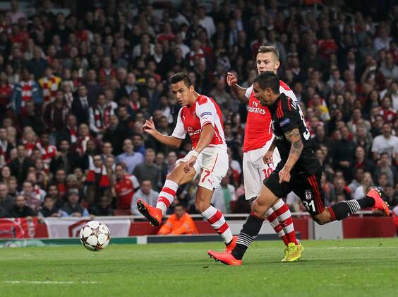 Arsenal s Alexis Sanchez scoring his sides opening goal - UEFA Champions League, Play-off Second Leg - Emirates Stadium - England - 27th August 2014 - Picture David Klein Sportimage EDITORIAL USE ONLY. No use with unauthorised audio, video, data, fixture lists, club league logos or live services. Online in-match use limited to 120 images, no video emulation. No use in betting, games or single club league player publications.