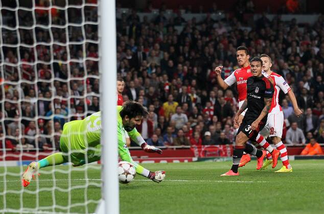 Arsenal s Alexis Sanchez scoring his sides opening goal - UEFA Champions League, Play-off Second Leg - Emirates Stadium - England - 27th August 2014 - Picture David Klein Sportimage EDITORIAL USE ONLY. No use with unauthorised audio, video, data, fixture lists, club league logos or live services. Online in-match use limited to 120 images, no video emulation. No use in betting, games or single club league player publications.