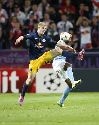 SOCCER - CL, Malmoe vs RBS MALMOE,SWEDEN,27.AUG.14 - SOCCER - UEFA Champions League, play off, Malmoe FF vs Red Bull Salzburg. Image shows Martin Hinteregger (RBS) and Isaac Kiese Thelin (Malmoe). 