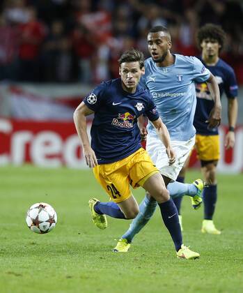 SOCCER - CL, Malmoe vs RBS MALMOE,SWEDEN,27.AUG.14 - SOCCER - UEFA Champions League, play off, Malmoe FF vs Red Bull Salzburg. Image shows Christoph Leitgeb (RBS) and Isaac Kiese Thelin (Malmoe). 