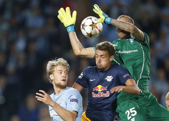 SOCCER - CL, Malmoe vs RBS MALMOE,SWEDEN,27.AUG.14 - SOCCER - UEFA Champions League, play off, Malmoe FF vs Red Bull Salzburg. Image shows Filip Helander (Malmoe), Stefan Ilsanker (RBS) and Robin Olsen (Malmoe). 