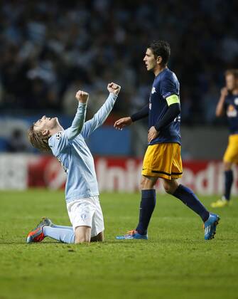 SOCCER - CL, Malmoe vs RBS MALMOE,SWEDEN,27.AUG.14 - SOCCER - UEFA Champions League, play off, Malmoe FF vs Red Bull Salzburg. Image shows Emil Forsberg (Malmoe) and Jonatan Soriano (RBS). 