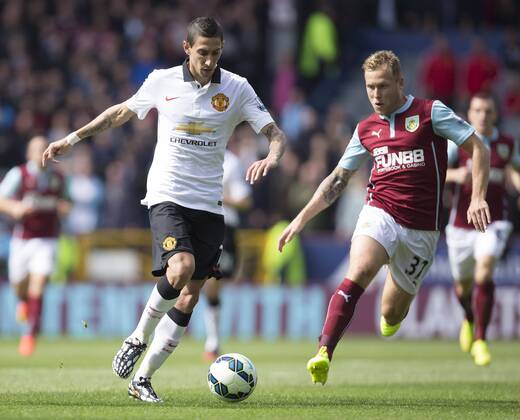 Scott Arfield of Burnley chases Angel di Maria of Manchester United - Burnley vs. Manchester United - Barclay s Premier League - Turf Moor - Burnley - 30 08 2014 Pic Philip Oldham Sportimage EDITORIAL USE ONLY. No use with unauthorised audio, video, data, fixture lists, club league logos or live services. Online in-match use limited to 120 images, no video emulation. No use in betting, games or single club league player publications.