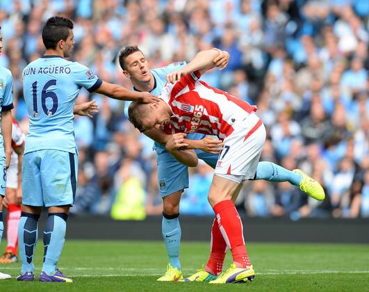 Stevan Jovetic of Manchester City clashes with Ryan Shawcross of Stoke City - Barclays Premier League - Manchester City vs Stoke City - Etihad Stadium - Manchester - England - 30th August 2014 - Picture Simon Bellis Sportimage EDITORIAL USE ONLY. No use with unauthorised audio, video, data, fixture lists, club league logos or live services. Online in-match use limited to 120 images, no video emulation. No use in betting, games or single club league player publications.