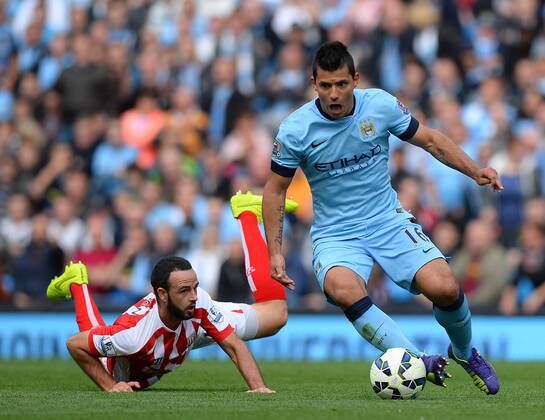 Marc Wilson of Stoke City chases after Sergio Aguero of Manchester City - Barclays Premier League - Manchester City vs Stoke City - Etihad Stadium - Manchester - England - 30th August 2014 - Picture Simon Bellis Sportimage EDITORIAL USE ONLY. No use with unauthorised audio, video, data, fixture lists, club league logos or live services. Online in-match use limited to 120 images, no video emulation. No use in betting, games or single club league player publications.