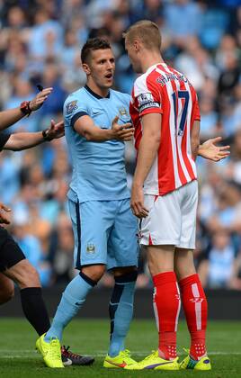 Stevan Jovetic of Manchester City clashes with Ryan Shawcross of Stoke City - Barclays Premier League - Manchester City vs Stoke City - Etihad Stadium - Manchester - England - 30th August 2014 - Picture Simon Bellis Sportimage EDITORIAL USE ONLY. No use with unauthorised audio, video, data, fixture lists, club league logos or live services. Online in-match use limited to 120 images, no video emulation. No use in betting, games or single club league player publications.