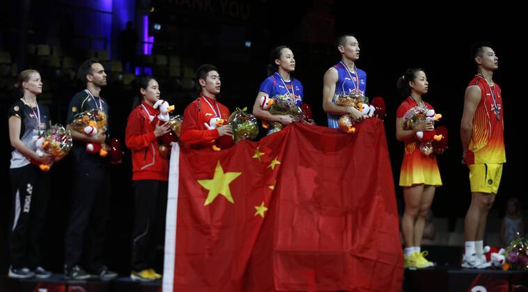 COPENHAGEN -- (From L to R) Christinna Pedersen and Joachim Fischer Nielsen of Denmark, Bao Yixin, Liu Cheng, Zhao Yunlei, Zhang Nan, Ma Jin and Xu Chen of China pose during the awarding ceremony for the Mixed Doubles Final on Day 7 of Li Ning BWF World Championships 2014 at Ballerup Super Arena in Copenhagen, Denmark on Aug. 31, 2014. 