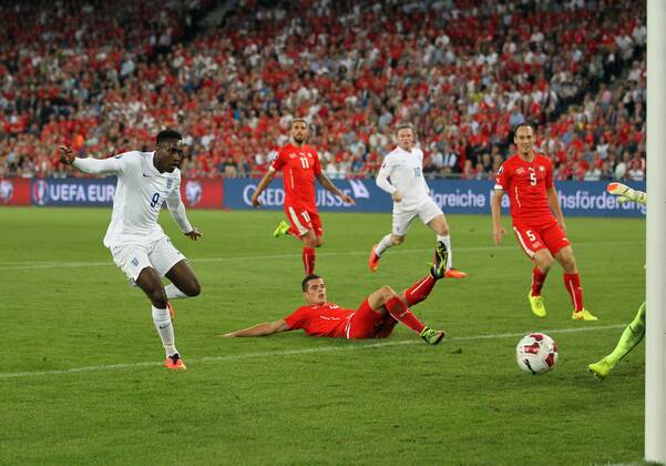 England s Danny Welbeck scoring his sides opening goal - Euro 2016 Qualifier Group E - Switzerland Vs England - St Jakob Park - Switzerland - 8th September 2014 - Picture David Klein Sportimage EDITORIAL USE ONLY. No use with unauthorised audio, video, data, fixture lists, club league logos or live services. Online in-match use limited to 120 images, no video emulation. No use in betting, games or single club league player publications.