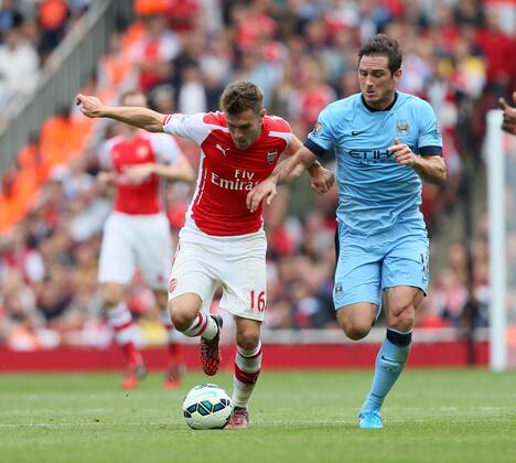 Arsenal s Aaron Ramsey tussles with Manchester City s Frank Lampard - Barclays Premier League - Arsenal v Manchester City - Emirates Stadium - England - 13th September 2014 - Picture David Klein Sportimage EDITORIAL USE ONLY. No use with unauthorised audio, video, data, fixture lists, club league logos or live services. Online in-match use limited to 120 images, no video emulation. No use in betting, games or single club league player publications.