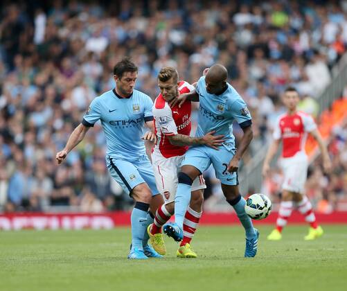Arsenal s Jack Wilshere tussles with Manchester City s Frank Lampard and Fernadinho - Barclays Premier League - Arsenal v Manchester City - Emirates Stadium - England - 13th September 2014 - Picture David Klein Sportimage EDITORIAL USE ONLY. No use with unauthorised audio, video, data, fixture lists, club league logos or live services. Online in-match use limited to 120 images, no video emulation. No use in betting, games or single club league player publications.