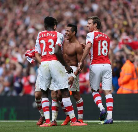 Arsenal s Alexis Sanchez celebrates scoring his sides second goal - Barclays Premier League - FC Arsenal London v Manchester City - Emirates Stadium - England - 13th September 2014 -EDITORIAL USE ONLY. No use with unauthorised audio, video, data, fixture lists, club league logos or live services. Online in-match use limited to 120 images, no video emulation. No use in betting, games or single club league player publications.