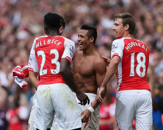 Arsenal s Alexis Sanchez celebrates scoring his sides second goal - Barclays Premier League - FC Arsenal London v Manchester City - Emirates Stadium - England - 13th September 2014 -EDITORIAL USE ONLY. No use with unauthorised audio, video, data, fixture lists, club league logos or live services. Online in-match use limited to 120 images, no video emulation. No use in betting, games or single club league player publications.