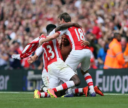 Arsenal s Alexis Sanchez celebrates scoring his sides second goal - Barclays Premier League - FC Arsenal London v Manchester City - Emirates Stadium - England - 13th September 2014 -EDITORIAL USE ONLY. No use with unauthorised audio, video, data, fixture lists, club league logos or live services. Online in-match use limited to 120 images, no video emulation. No use in betting, games or single club league player publications.