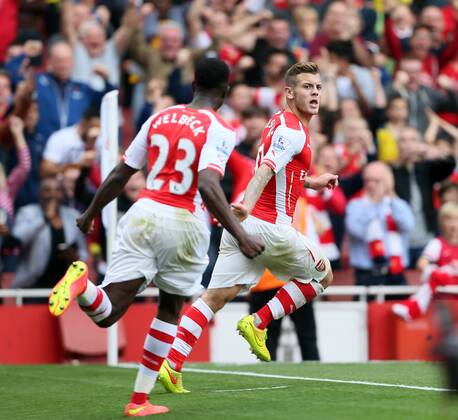 Arsenal s Jack Wilshere celebrates scoring his sides opening goal - Barclays Premier League - FC Arsenal London v Manchester City - Emirates Stadium - England - 13th September 2014 -EDITORIAL USE ONLY. No use with unauthorised audio, video, data, fixture lists, club league logos or live services. Online in-match use limited to 120 images, no video emulation. No use in betting, games or single club league player publications.