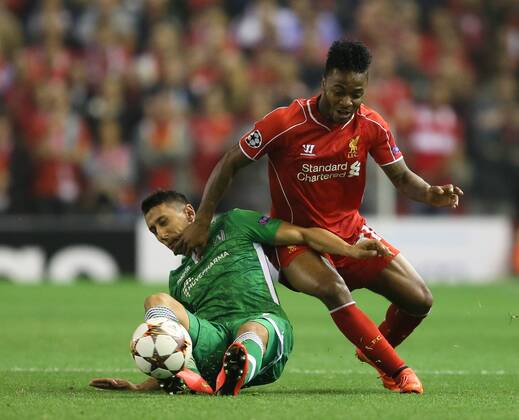 Raheem Sterling of Liverpool tussles with Mihail Aleksandrov of Ludogorets - UEFA Champions League Group B - Liverpool vs Ludogorets Razgrad - Anfield Stadium - Liverpool - England - 16th September 2014 - Picture Simon Bellis Sportimage EDITORIAL USE ONLY. No use with unauthorised audio, video, data, fixture lists, club league logos or live services. Online in-match use limited to 120 images, no video emulation. No use in betting, games or single club league player publications.