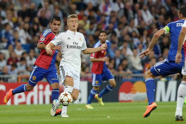 FC Basel Midfielder, Fabian Frei - Fabian Frei, number 20 . Real Madrid Midfielder, Toni Kroos - KROOS, number 8. Round 1 of the CHAMPIONS league, soccer match between Real Madrid - FC Basel at the Santiago Bernabeu estadium, Madrid - Spain by September 16, 2014. 