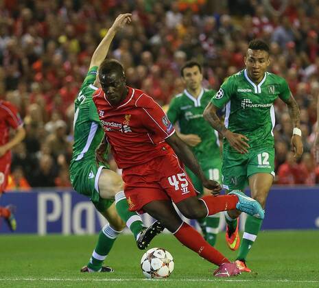 Mario Balotelli of Liverpool looses his marker Cosmin Moti of Ludogorets - UEFA Champions League Group B - Liverpool vs Ludogorets Razgrad - Anfield Stadium - Liverpool - England - 16th September 2014 - Picture Simon Bellis Sportimage EDITORIAL USE ONLY. No use with unauthorised audio, video, data, fixture lists, club league logos or live services. Online in-match use limited to 120 images, no video emulation. No use in betting, games or single club league player publications.