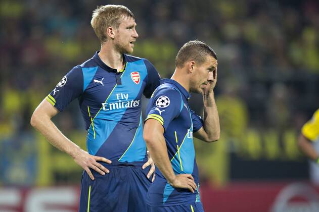 Dortmund, 16.09.2014, Signal-Iduna-Park Per Mertesacker (Arsenal), Lukas Podolski (Arsenal) enttäuscht Borussia Dortmund - FC Arsenal London