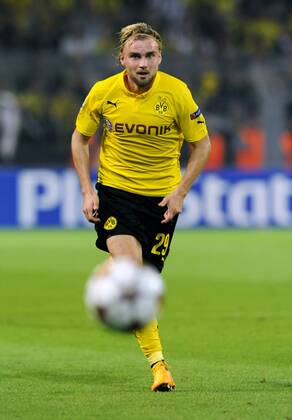 Fussball, UEFA Champions League, Herren, Saison 2014 2015, Gruppe D, 1. Spieltag, Signal Iduna Park Dortmund, Bor. Dortmund, BVB (gelb) - Arsenal London (blau) 2:0; Marcel Schmelzer (BVB). Aktion, Einzelbild, Freisteller.
