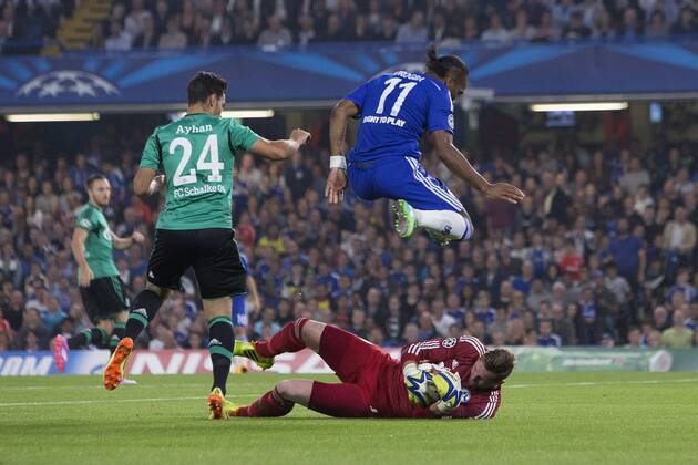 Ralf Fahrmann of Schalke saves before Didier Drogba of Chelsea can get a shot away - Chelsea vs. Schalke 04 - UEFA Champions League - Stamford Bridge - London - 17 09 2014 Pic Philip Oldham Sportimage EDITORIAL USE ONLY. No use with unauthorised audio, video, data, fixture lists, club league logos or live services. Online in-match use limited to 120 images, no video emulation. No use in betting, games or single club league player publications.