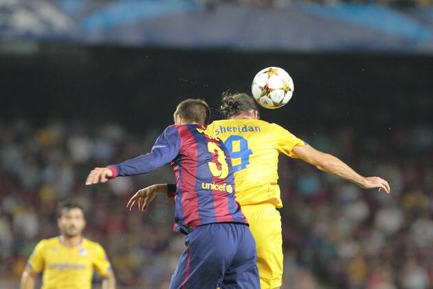 BARCELONA, Spain: Gerard Pique, Cillian Sheridan - Champions League, FC Barcelona vs. APOEL Nicosia. 