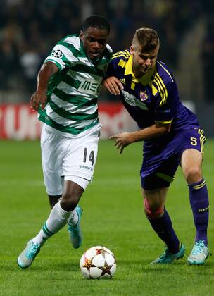 SOCCER - CL, Maribor vs Sporting MARIBOR,SLOVENIA,17.SEP.14 - SOCCER - UEFA Champions League, group stage, NK Maribor vs Sporting Clube de Portugal. Image shows William Carvalho (Sporting) and Zeljko Filipovic (Maribor). 