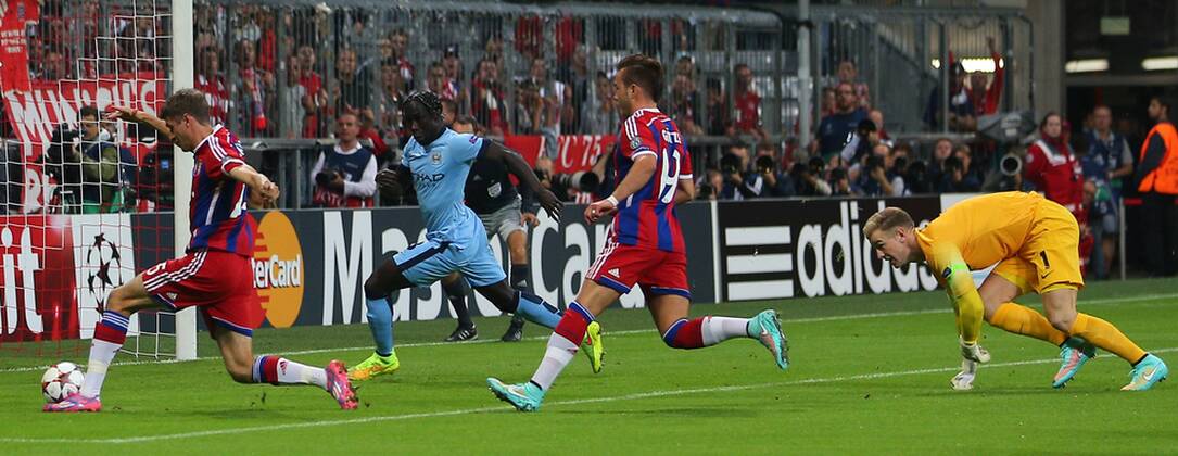 SOCCER - CL, Bayern vs Man.City MUNICH,GERMANY,17.SEP.14 - SOCCER - UEFA Champions League, group stage, FC Bayern München vs Manchester City. Image shows Thomas Mueller (Bayern), Bacary Sagna (Man.City), Mario Goetze (Bayern) and Joe Hart (Man.City). 