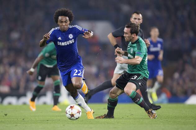 Christian Fuchs of Schalke tackles Willian of Chelsea - Chelsea vs. Schalke 04 - UEFA Champions League - Stamford Bridge - London - 17 09 2014 Pic Philip Oldham Sportimage EDITORIAL USE ONLY. No use with unauthorised audio, video, data, fixture lists, club league logos or live services. Online in-match use limited to 120 images, no video emulation. No use in betting, games or single club league player publications.